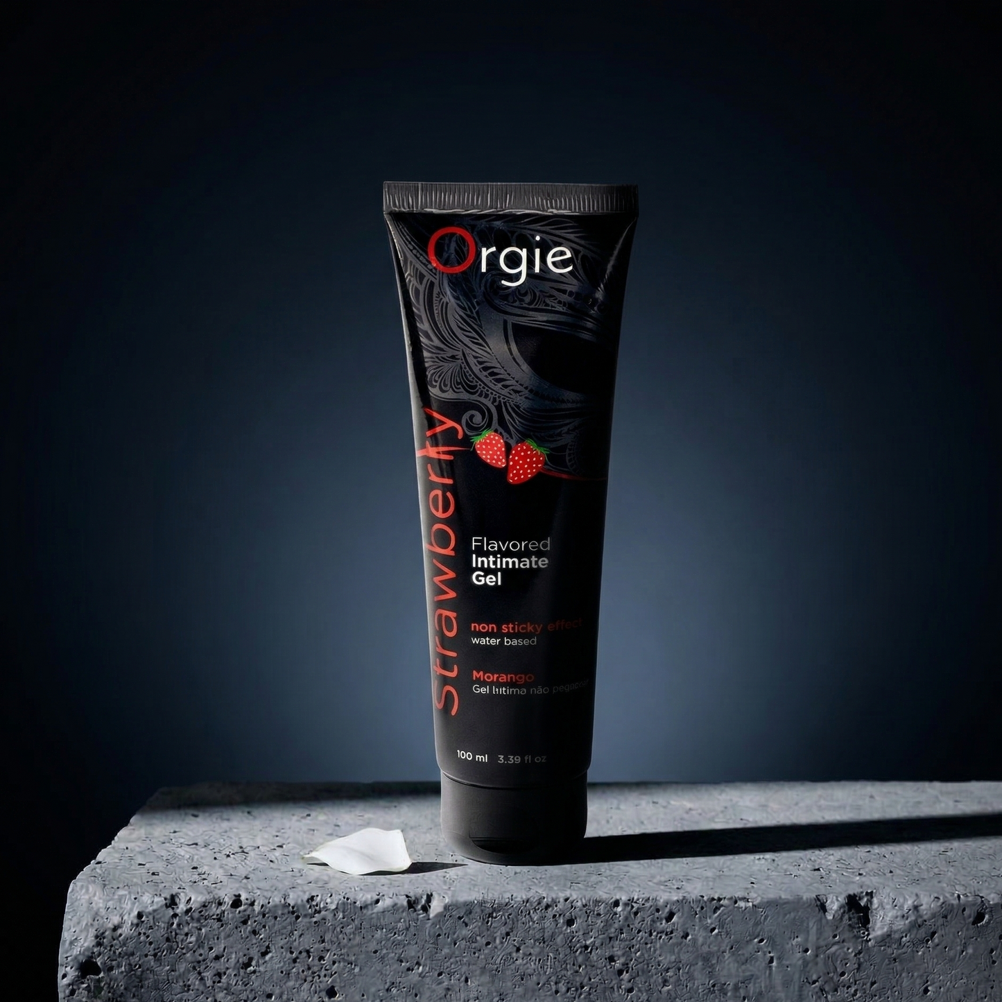 Tube of Orgie Strawberry flavored intimate gel on a dark background