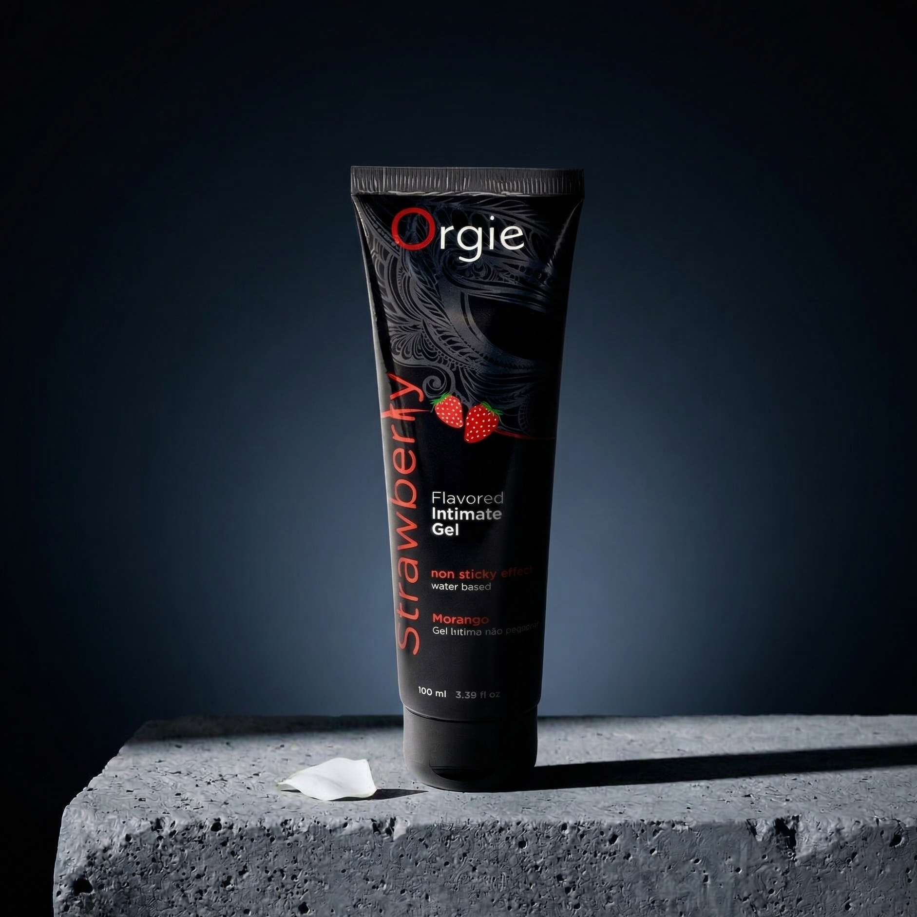 Tube of Orgie Strawberry flavored intimate gel on a dark background