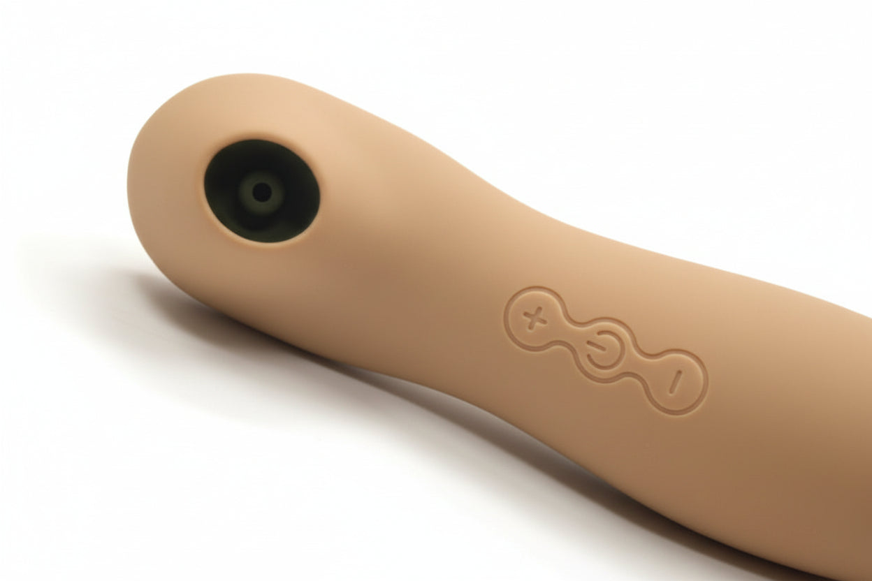 Close-up of The Hush in Shifting Sand, showing the soft, open silicone head engineered for aerodynamic pressure wave technology."