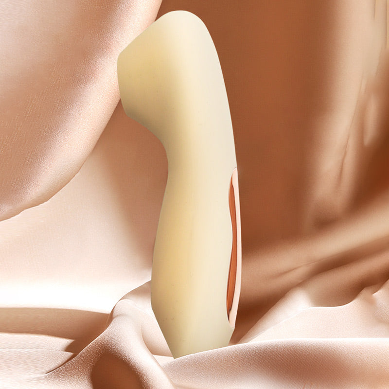 The Hush air-pulse stimulator by Sigh in Shifting Sand. A sleek, ergonomic device with a circular silicone nozzle designed for non-contact clitoral stimulation.