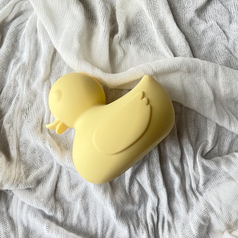 The Muse vanilla silicone waterproof bath vibrator in abstract organic duck shape.