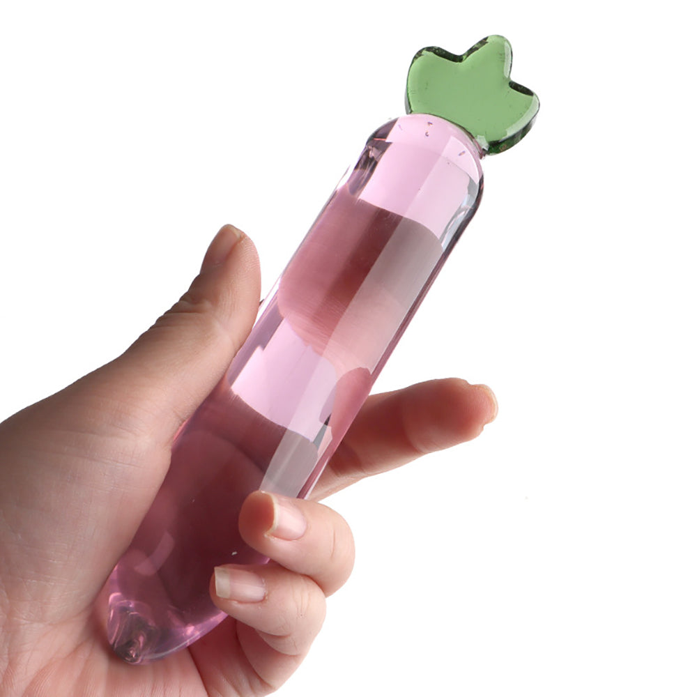Profile view of The Root in pink and green glass, highlighting the rounded 'bulb' shape designed for internal retention and texture play."
