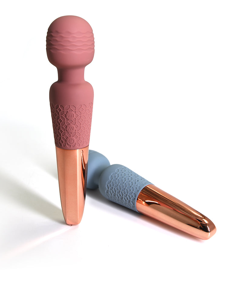 The Scepter luxury wand vibrator in Stone Blue and Pale Mauve, featuring a minimalist honeycomb silicon body balanced by a Rose Gold Accent.