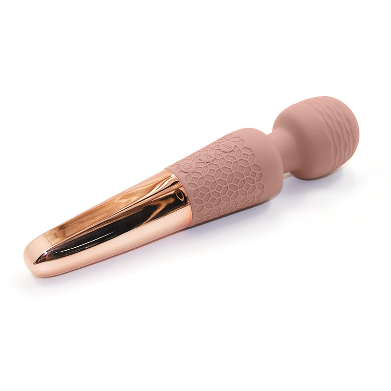 The Scepter luxury power wand by Sigh in Pale Mauve. A handheld massager with a flexible silicone head and rose-gold accent ring, designed fora rumbling clitoral stimulation."